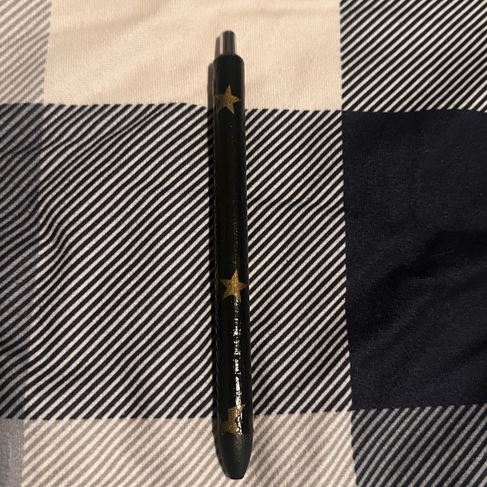 Homemade black pen with gold stars